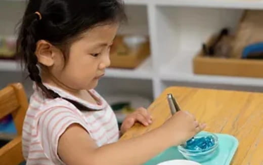 a young girl painting
