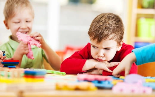 a couple of kids playing with toys