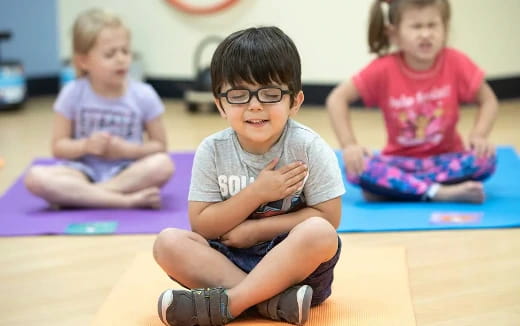 a group of children sitting on the floor