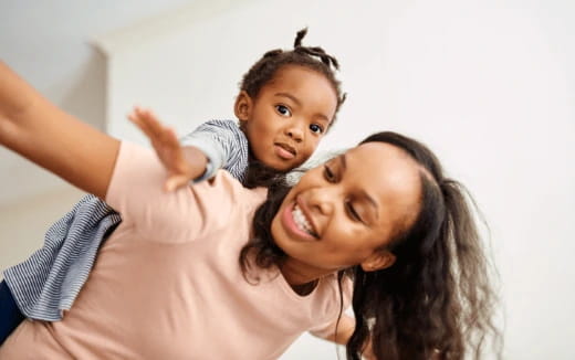 a person holding a child