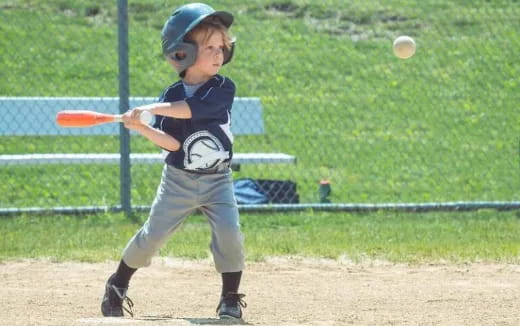 a young boy playing baseball