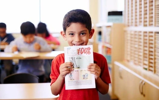 a boy holding a sign