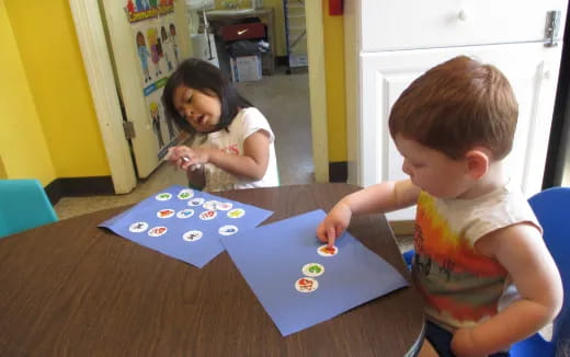 a couple of children playing with toys