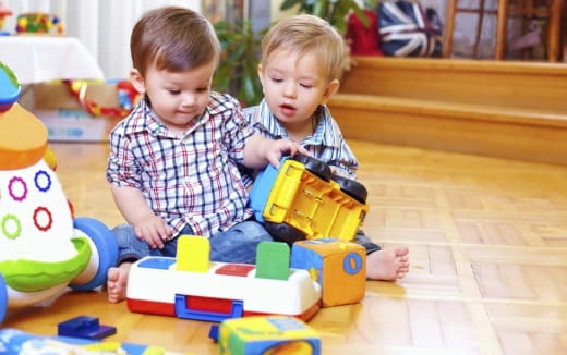two children playing with toys