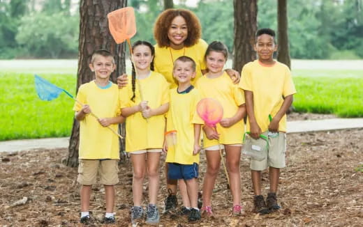 a group of kids holding a toy