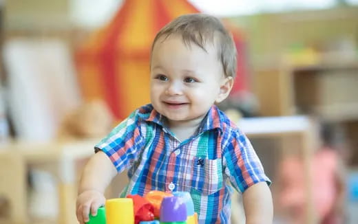 a child holding a toy