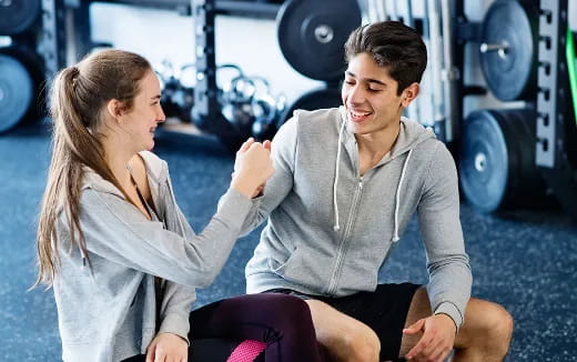 a man and a woman sitting on the floor