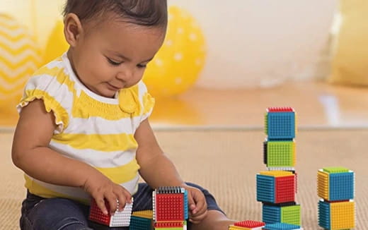 a baby playing with toys