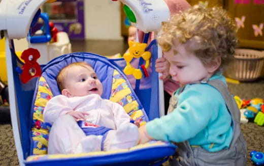 a baby in a baby carrier