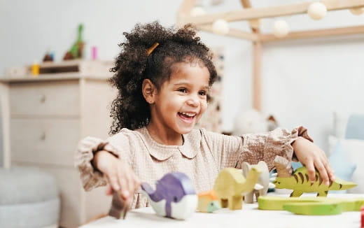 a baby playing with toys