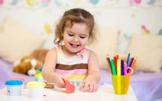 a child coloring on a paper