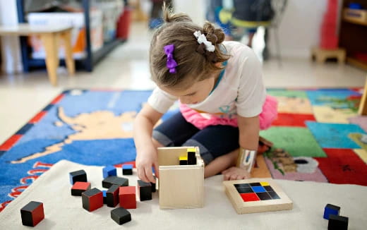 a child playing with blocks