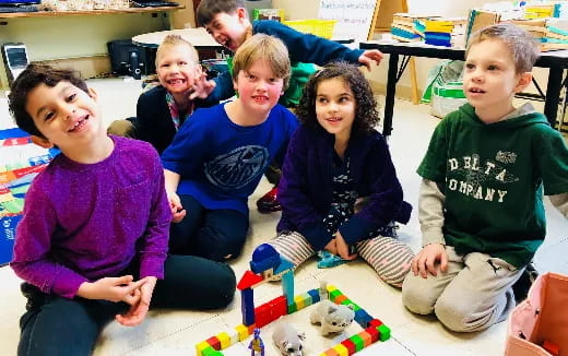 a group of children sitting on the floor