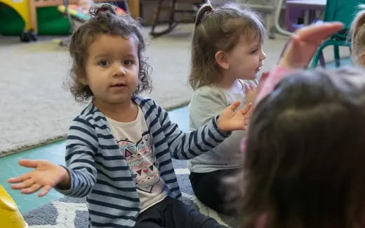 a group of children clapping
