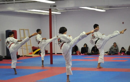 a group of people in karate uniforms