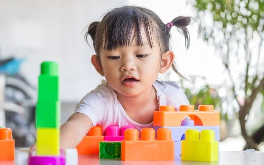 a baby playing with toys