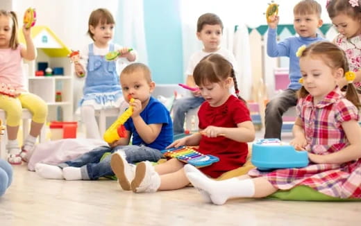 a group of children sitting on the floor