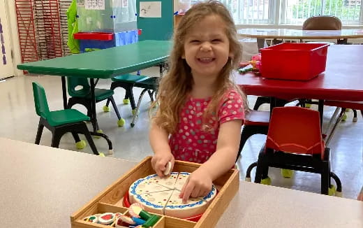 a girl sitting at a table