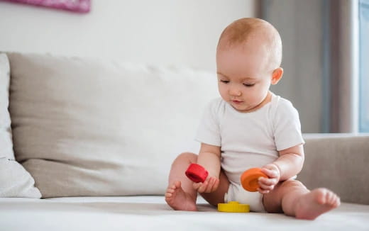 a baby playing with toys