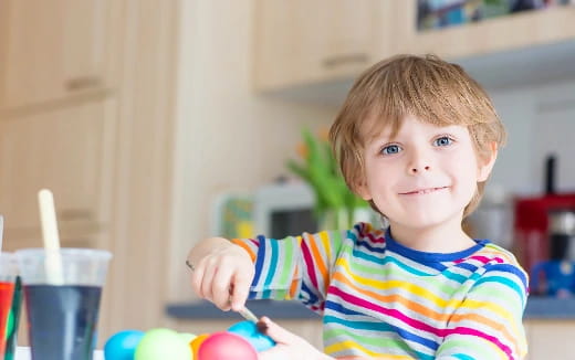 a child holding a spoon