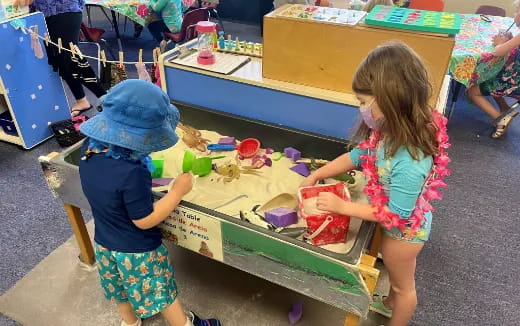 children painting on a table