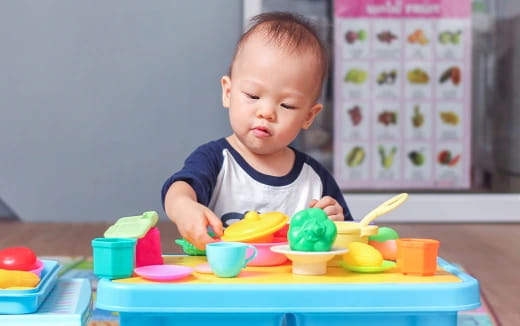 a baby playing with toys