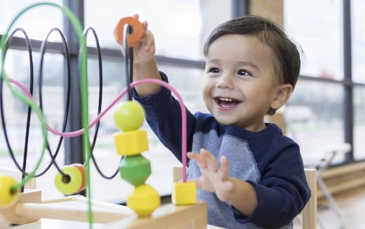 a child holding a toy