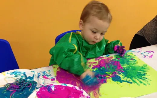 a child sitting at a table