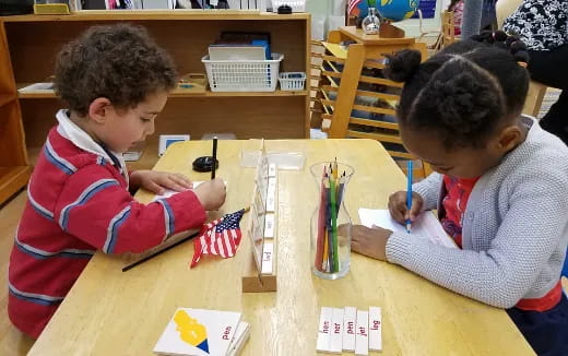a few children sitting at a table