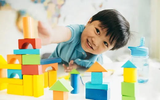 a child playing with blocks