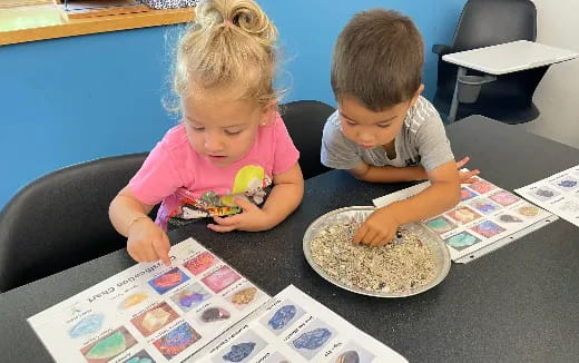 a couple of children eating