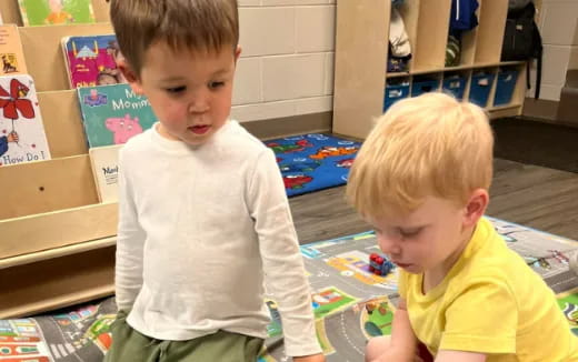 a couple of boys playing with toys
