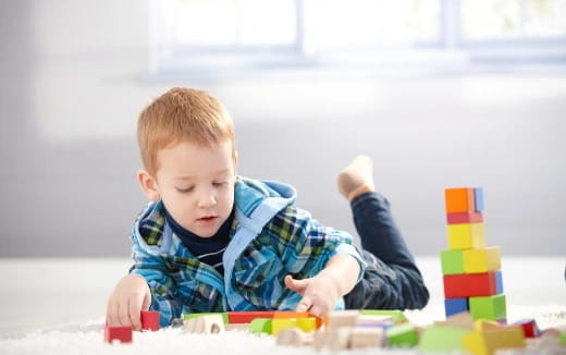 a baby playing with toys