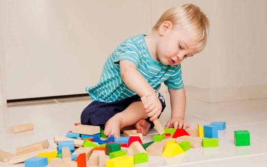 a child playing with blocks