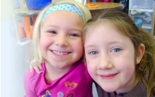 a couple of girls smiling