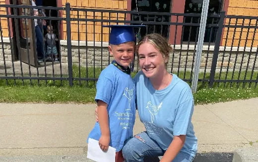 a person and a boy posing for a picture
