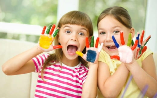 two kids with toothbrushes