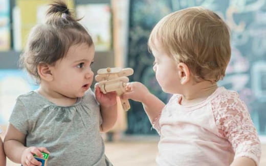 a couple of children eating