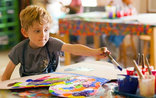 a young boy painting