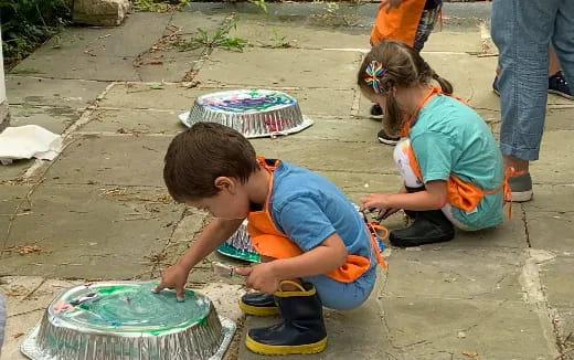 children playing with a bucket