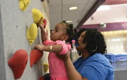 a person holding a child