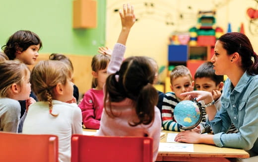 a teacher teaching her students