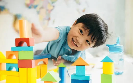 a child playing with blocks