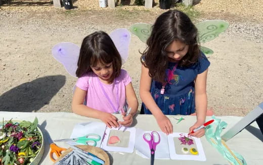 a couple of girls painting