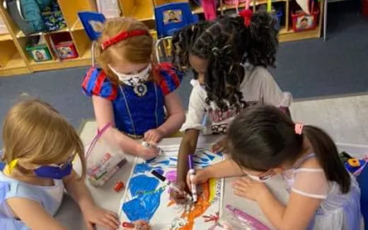 a group of children painting