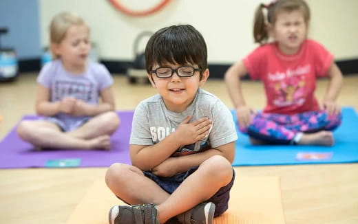 a group of children sitting on the floor