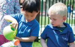 a couple of boys playing with balls