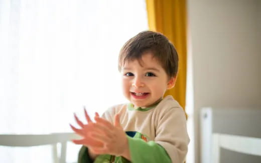 a child holding a plant