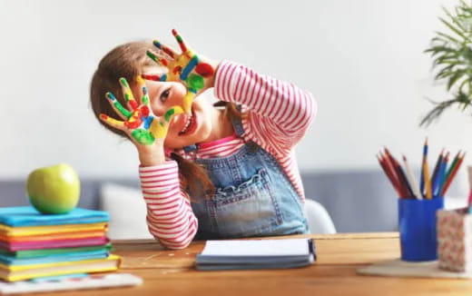 a child sitting at a desk