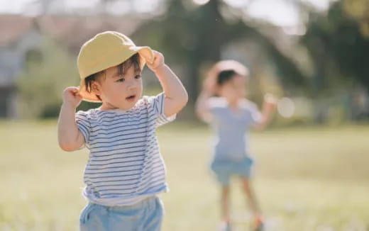 a young boy wearing a hat